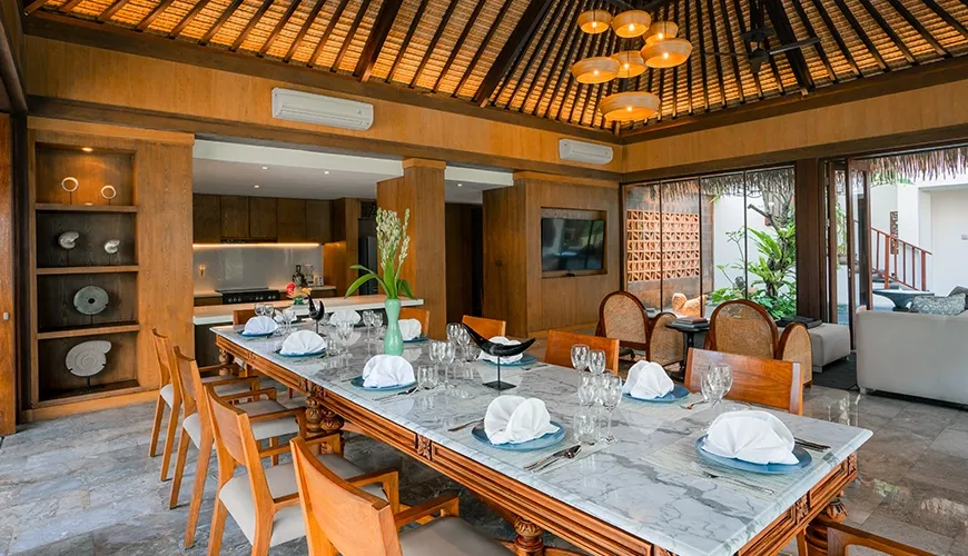 Luxury villa dining room with beautiful marble table and exquisite wood rattan chairs at Villa Bangkuang