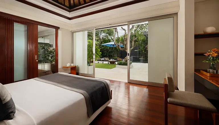 Bali villa bedroom with private garden access at Villa Camellia
