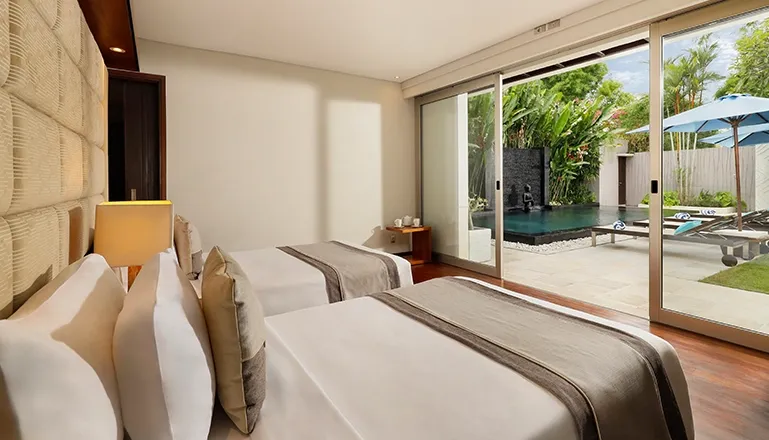 Bali villa twin bedroom with direct pool access at Villa Camellia