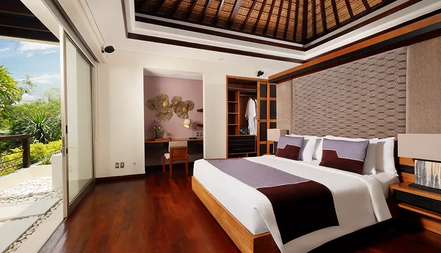 Luxury Bali villa master bedroom with tropical views at Villa Camellia