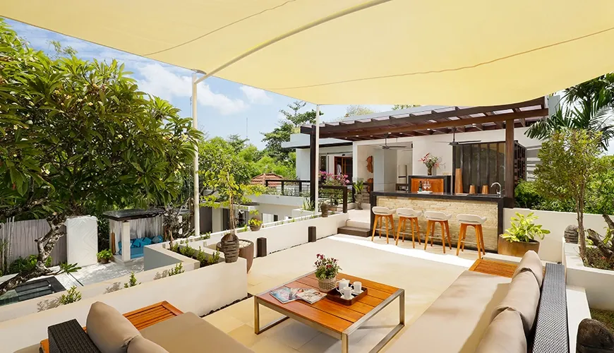 Luxury Bali villa rooftop lounge with outdoor bar at Villa Camellia