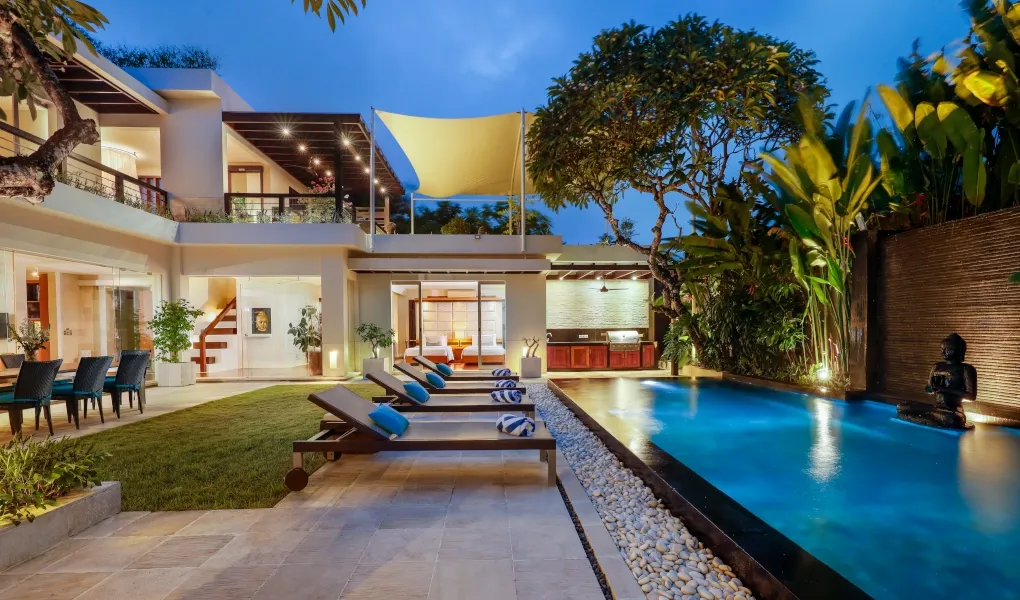 Villa exterior with a pool and lush tropical garden at Villa Camellia