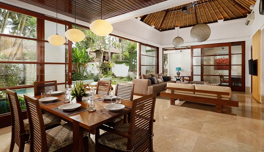 Beautiful villa dining room with a long wooden table and chairs at Villa Danis