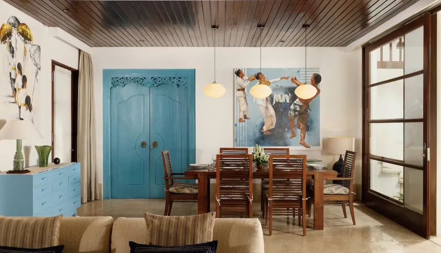 Elegant dining area, unique blue doors at Villa Danis