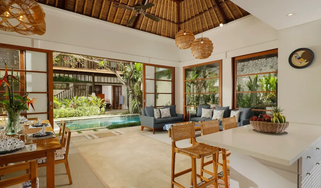 Open-plan villa living area with pool and garden at Villa Edward