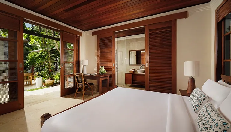 Peaceful Bali villa bedroom with natural wood tones at Villa Edward