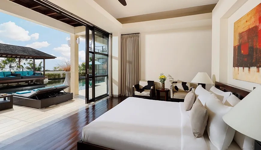 Stylish bedroom in a villa with a direct view of a swimming pool at Villa Jamalu