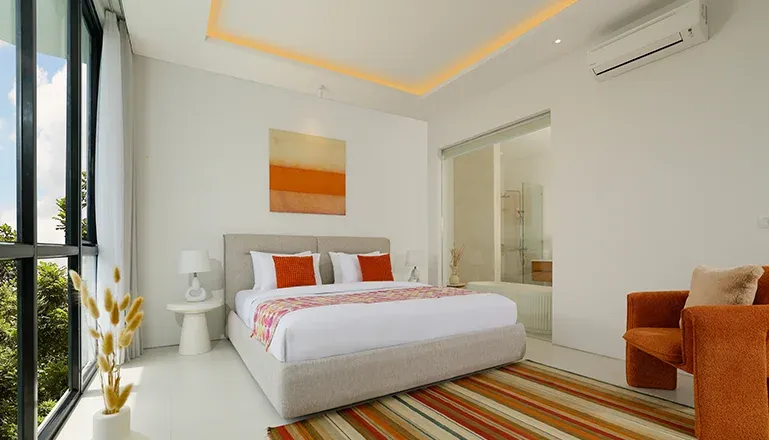 Beautiful bedroom with a minimalist aesthetic and a view at Villa Kalem Canggu