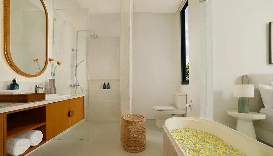 Beautiful master bath with a spacious vanity and soaking tub at Villa Kalem Canggu
