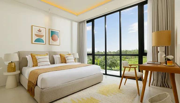 Spacious bedroom featuring a comfortable bed and minimalist design at Villa Kalem Canggu