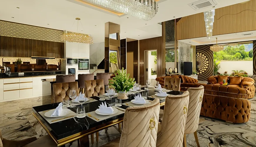 Elegant dining room crystal chandelier brown velvet chairs modern kitchen exquisite interior at Villa Kalem Uluwatu
