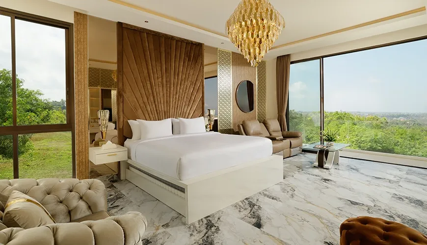 Grand master bedroom opulent chandelier white bed panoramic window views at Villa Kalem Uluwatu