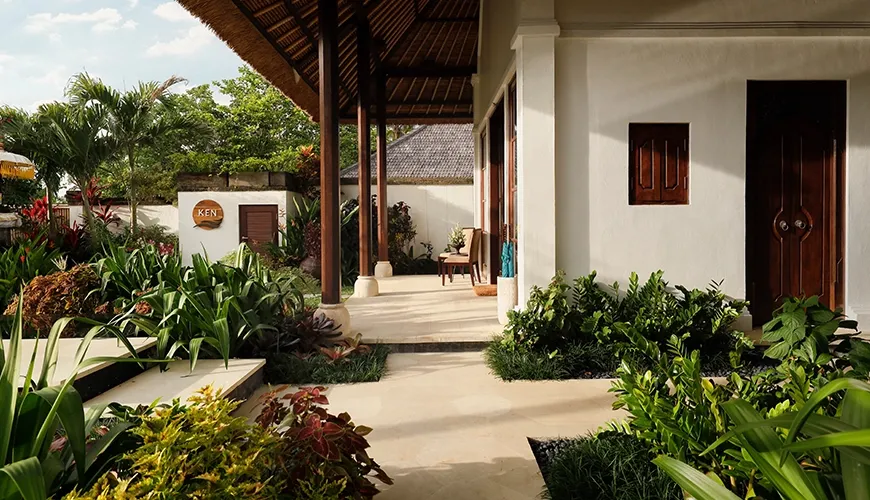 Beautiful and serene private villa garden with a covered outdoor pavilion and lush tropical plants at Villa Ken