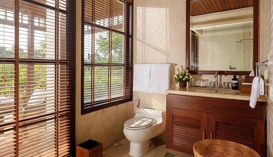 Beautiful private villa bathroom features a spacious vanity area and a large window with serene garden views at Villa Ken