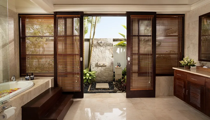 Luxurious and spacious villa bathroom with a soaking tub and a beautiful open-air shower area at Villa Ken