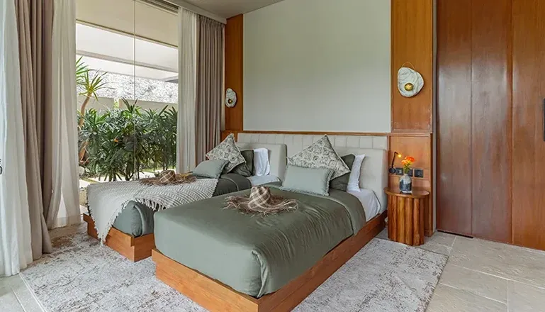 Beautiful bedroom with a minimalist design and wooden details at Villa Morada