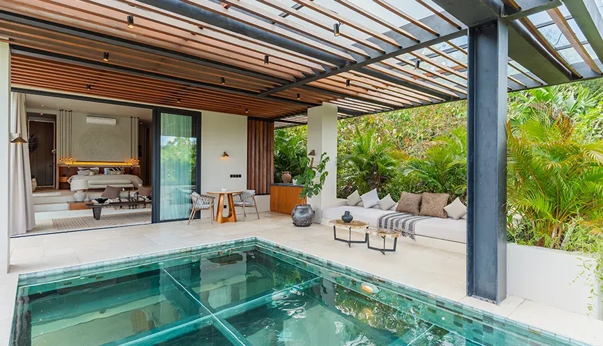Stylish living area featuring a pool and comfortable seating at Villa Morada