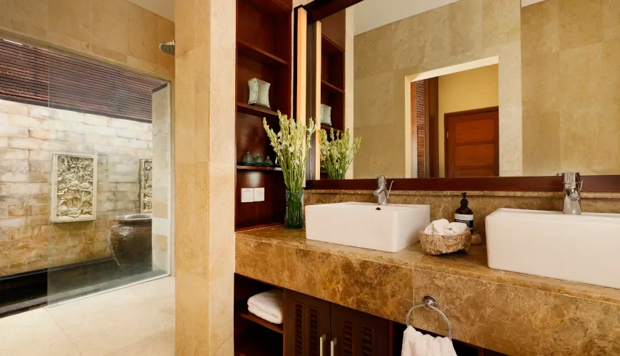 Luxury bathroom with dual sinks and an open-air shower at Naga Sutra Villa
