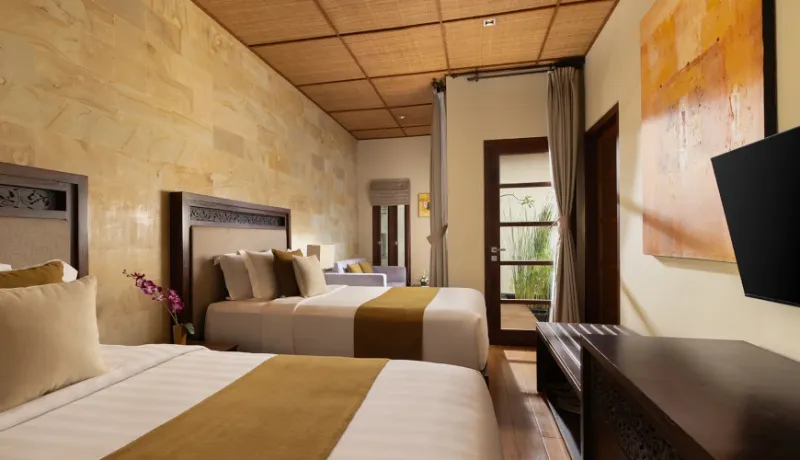 Well-appointed twin beds, serene ambiance at Villa Nagasutra