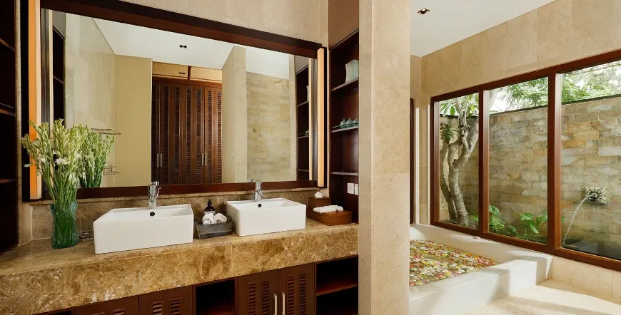 Luxurious master bathroom, dual sinks, flower bath at Villa Nagasutra