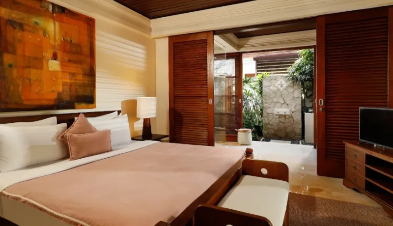 Comfortable bedroom, unique outdoor shower at Villa Nayra