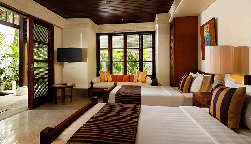 Inviting villa twin bedroom with two comfortable beds and a peaceful view of the garden at Villa Nayra