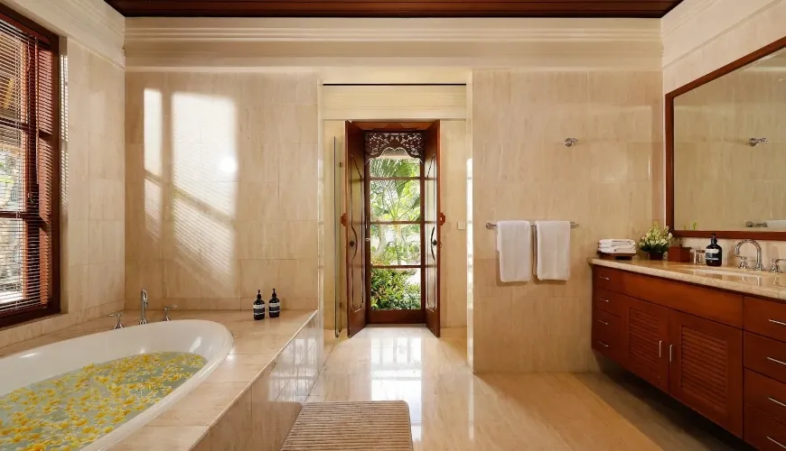 Luxurious marble bathroom, inviting freestanding bathtub at Villa Nayra