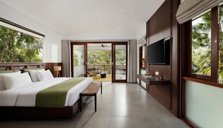 Sleek, modern bedroom with large windows and a private balcony at Villa Omekali