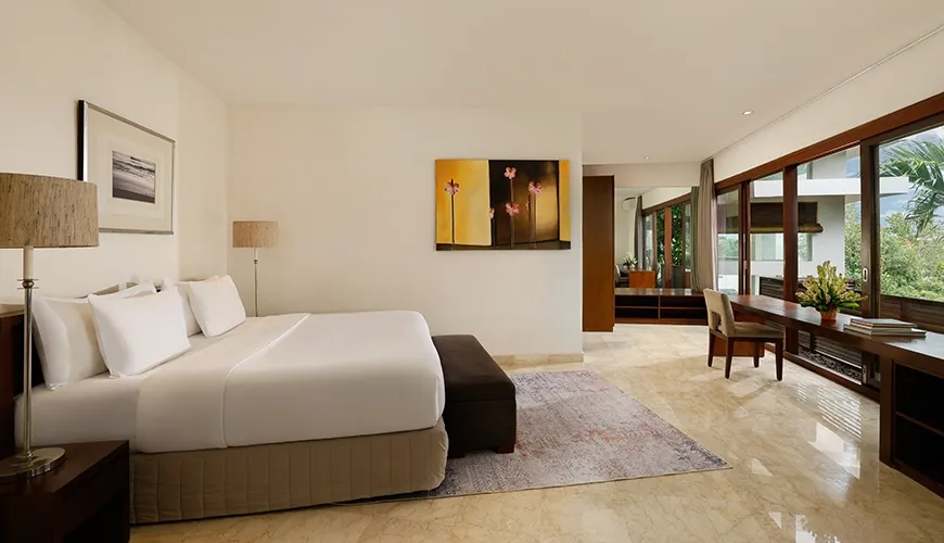 Spacious master bedroom with modern decor and desk area at Villa Oshra