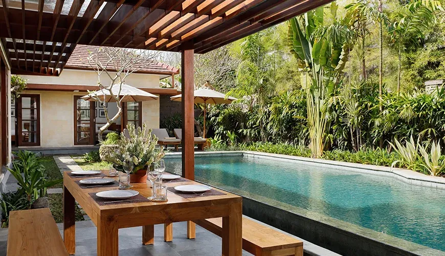 Relaxing outdoor dining space near a stunning pool at Villa Perere9