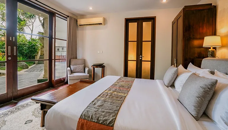 Bali villa bedroom with direct garden acces at Villa Pulung Jimbaran