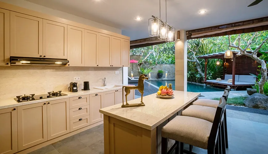 Modern Bali villa kitchen with direct pool access at Villa Pulung Jimbaran