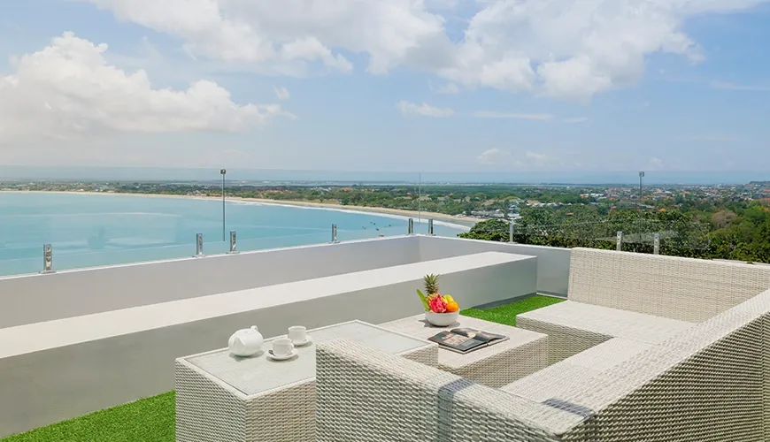 Luxury Bali villa rooftop lounge with panoramic ocean view at Villa Santos Cliff View