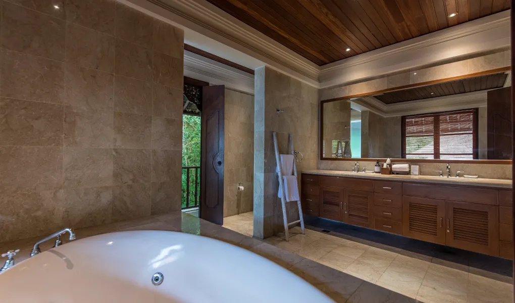 Spacious master bathroom with bathtub and double vanity at Villa Senada