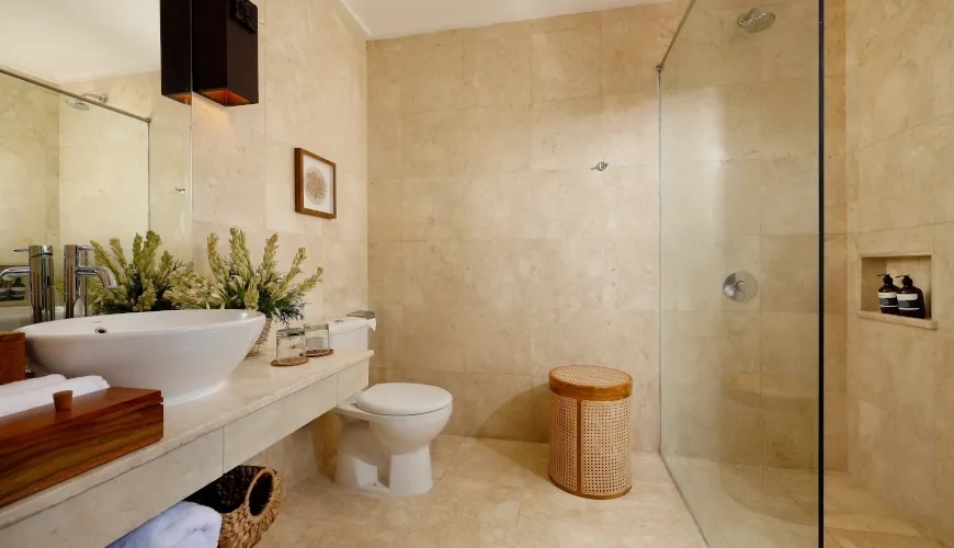 Bright bathroom with modern sink and glass shower at Villa Sophie