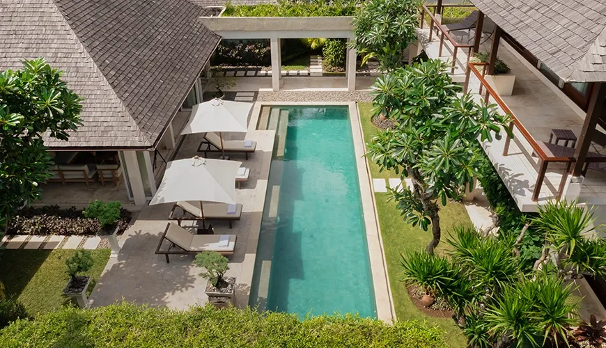 Aerial view villa multiple buildings swimming pool greenery at Villa Tenang