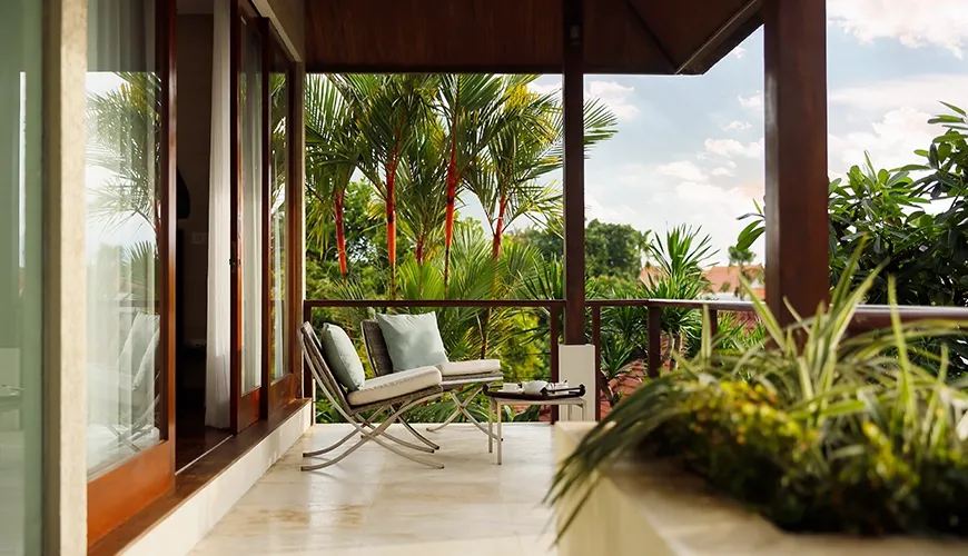 Alfresco seating breezy balcony tropical garden at Villa Tenang