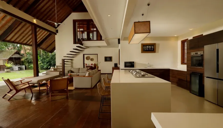 Open-plan communal living and dining area with artistic decor at Villa Tirtadari