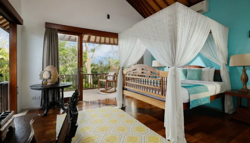 Bali bedroom four-poster bed balcony at Villa Uma Nina