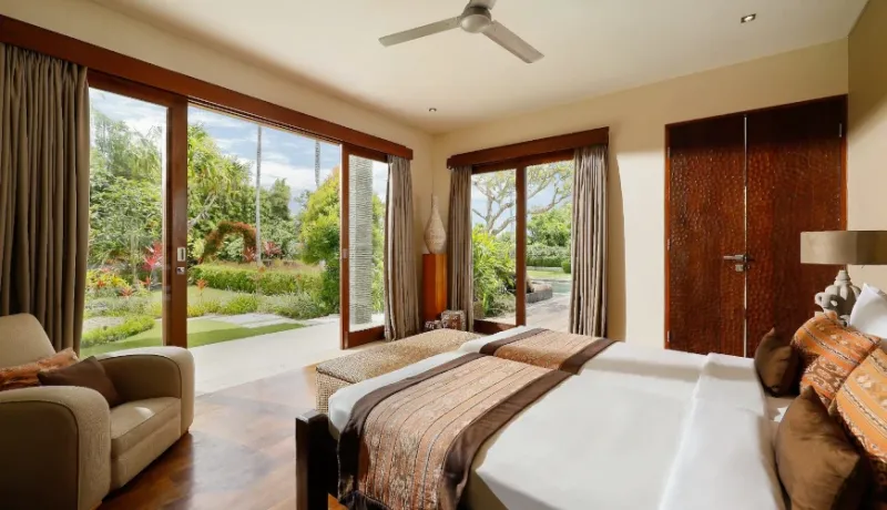 Comfortable Bali twin bedroom garden view at Villa Uma Nina