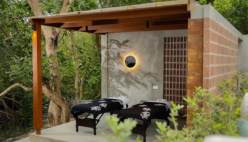 Relaxing tropical villa features an open-air spa treatment area