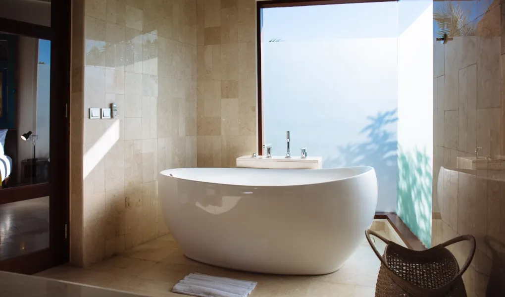 Modern standalone bathtub in a spacious ensuite bathroom at Villa Umah Daun