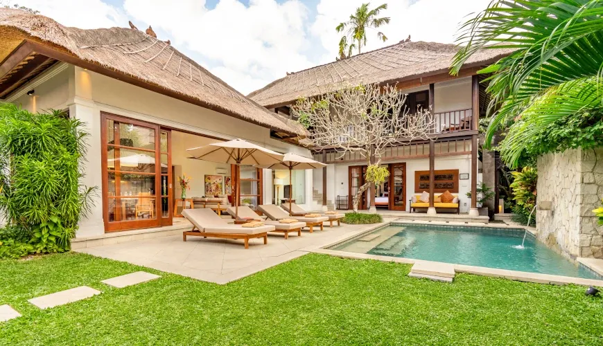 Balinese villa outdoor pool and lush tropical gardenat Villa Umarya