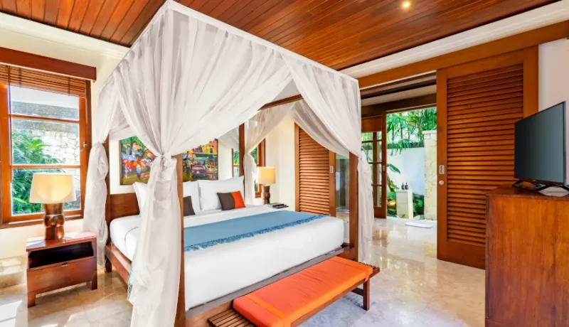 Beautiful villa bedroom with elegant white canopy bed at Villa Umarya