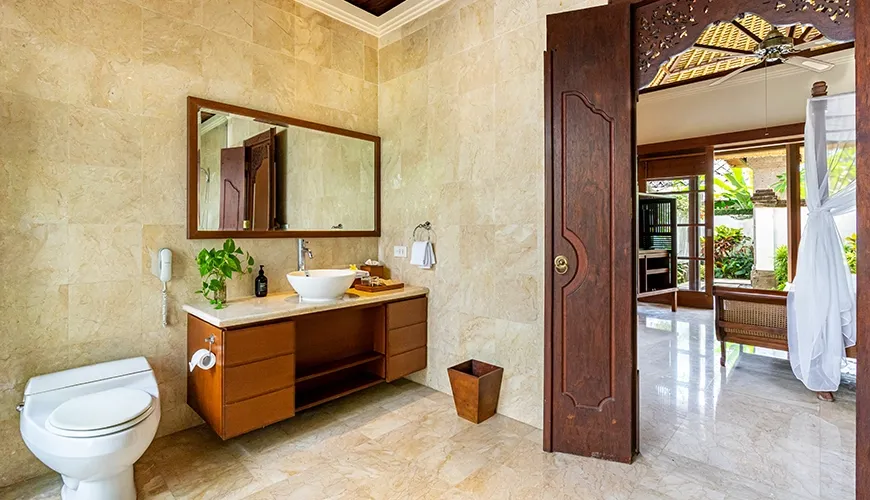 Clean and elegant villa bathroom with a floating vanity and a bright white vessel sink at Villa Umarya