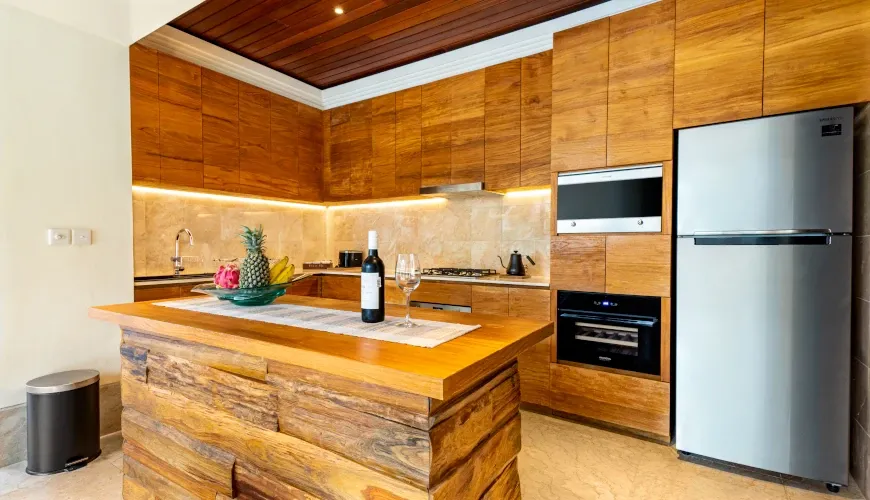 Fully equipped modern kitchen with beautiful wood design at Villa Umarya