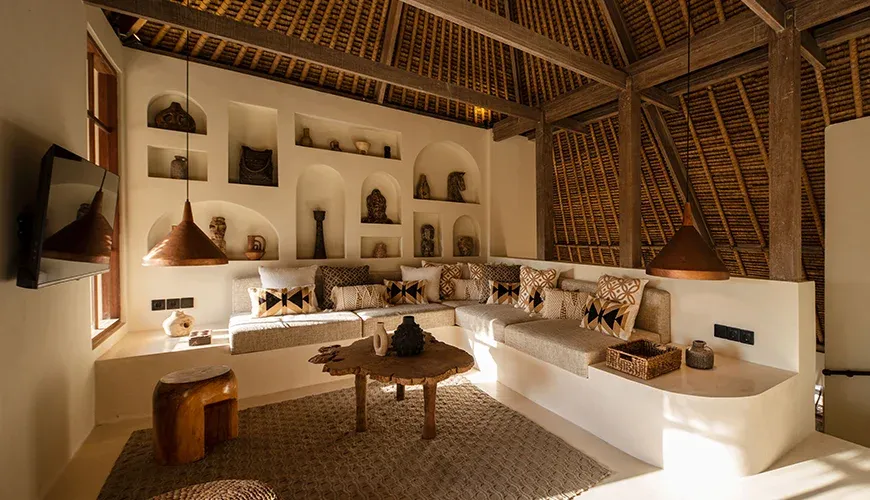 Contemporary entertainment space with a large screen and cushions at Villa Xanadu