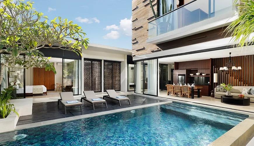 Luxury modern two-story villa featuring a private swimming pool and outdoor lounge area at Vinila Villas Duplex