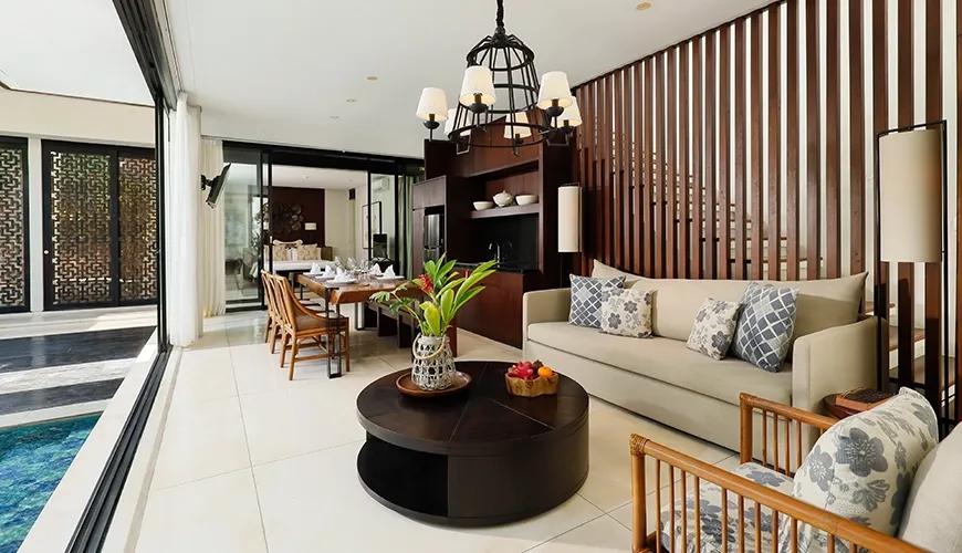 Modern luxury villa interior with a spacious living room and wooden dining area at Vinila Villas Duplex