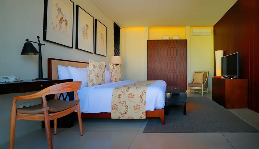 Luxury modern bedroom with a TV and wooden desk at vinila villas